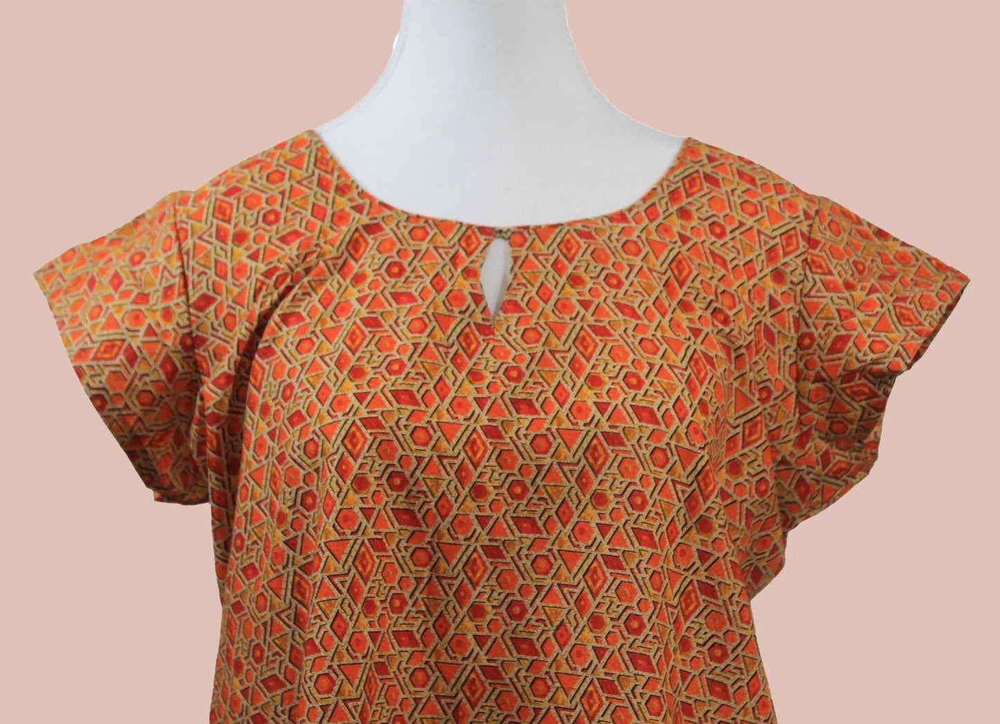 Orange and red printed kurta in casual cotton style from Muvvas Boutique.